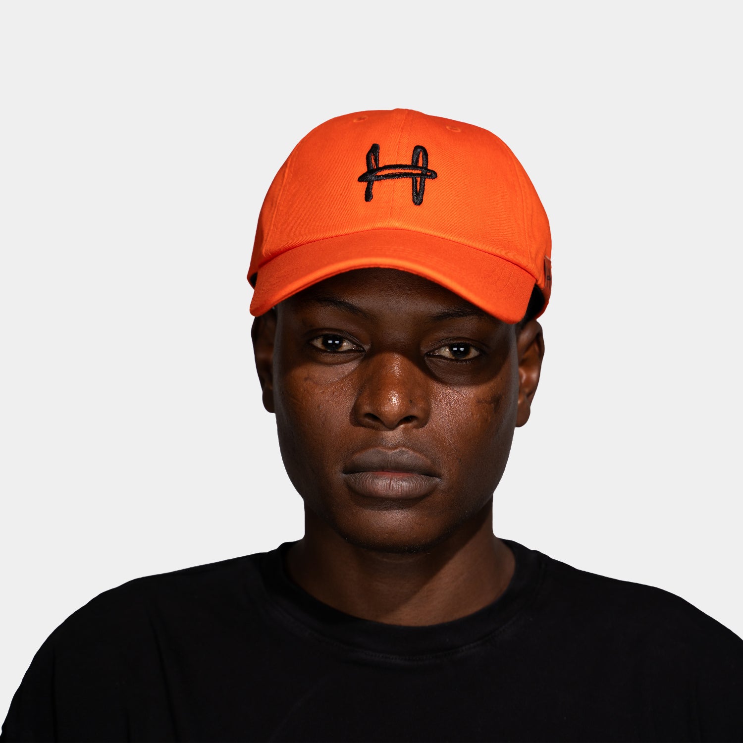 a cap with an h on it